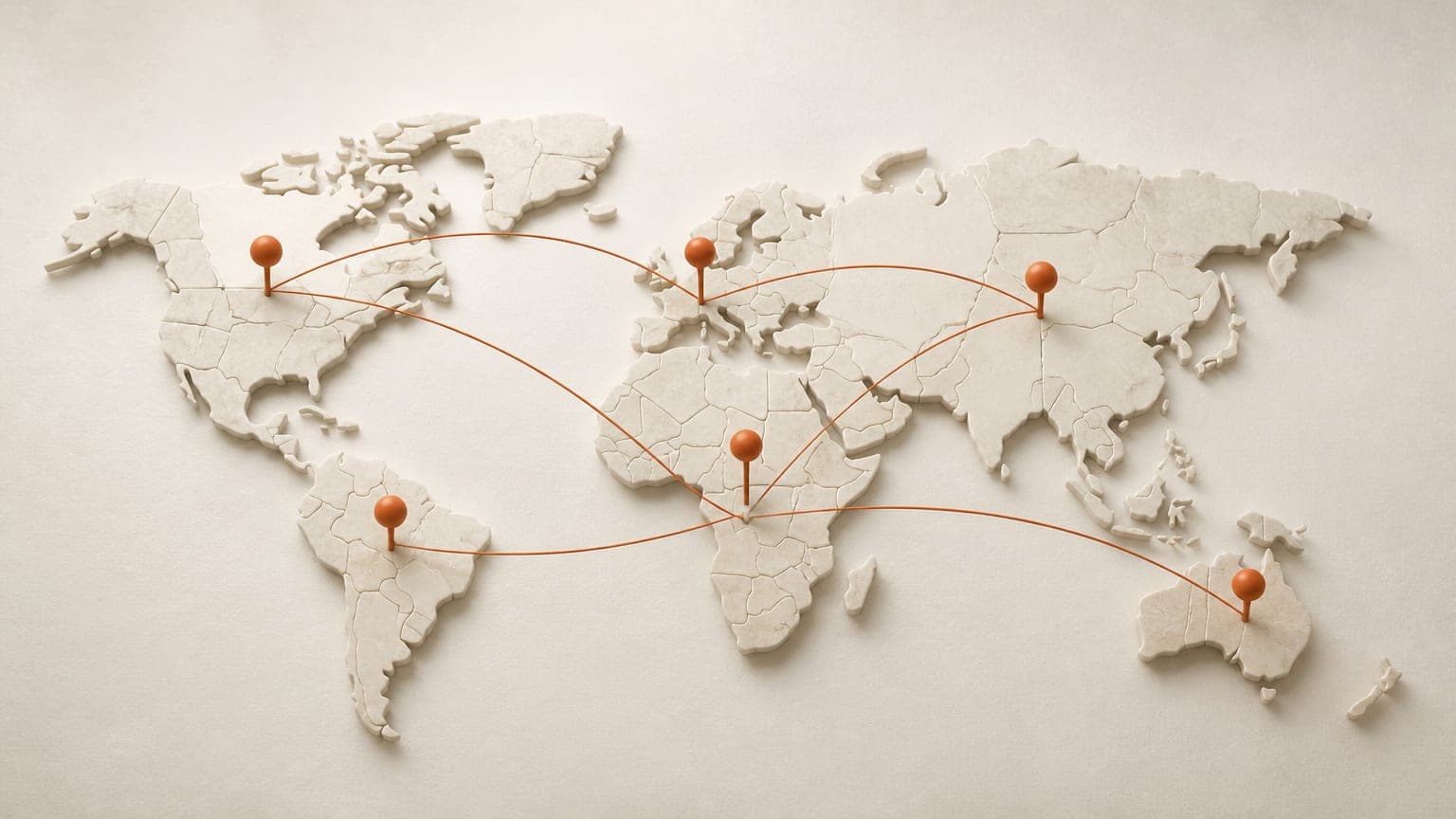 A minimal world map made of stone-colored tiles with a few orange pins connected by arcs